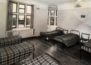 Picture of a 1960s boarding school dormitory